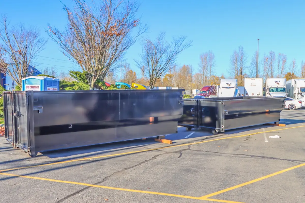 Professional dumpster rental service with roll-off container on residential driveway in Glencoe